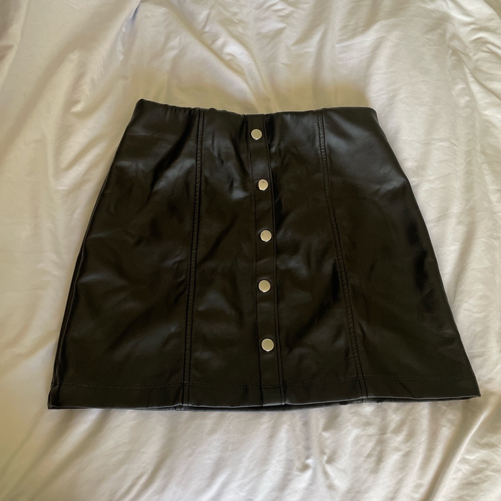 Black leather skirt with bottons on front